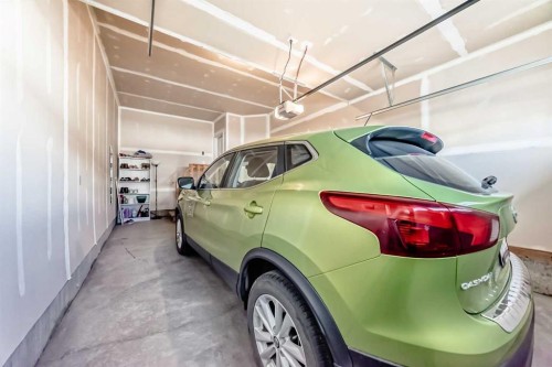615 Kingsmere Way Se, Airdrie, AB - Indoor Photo Showing Garage