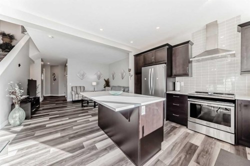 615 Kingsmere Way Se, Airdrie, AB - Indoor Photo Showing Kitchen With Upgraded Kitchen