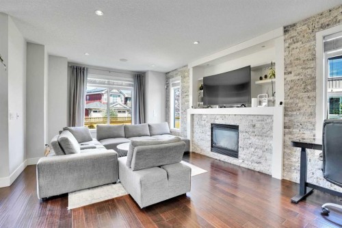 172 Kinniburgh Way, Chestermere, AB - Indoor Photo Showing Living Room With Fireplace