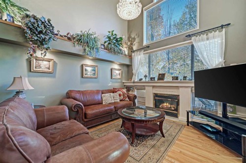 114 Valley Ponds Crescent Nw, Calgary, AB - Indoor Photo Showing Living Room With Fireplace
