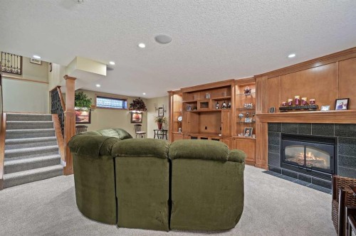 114 Valley Ponds Crescent Nw, Calgary, AB - Indoor Photo Showing Other Room With Fireplace