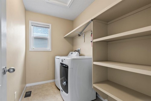 1043 Copperfield Boulevard Se, Calgary, AB - Indoor Photo Showing Laundry Room
