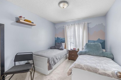 168 Fairways Drive Nw, Airdrie, AB - Indoor Photo Showing Bedroom
