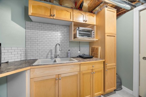 168 Fairways Drive Nw, Airdrie, AB - Indoor Photo Showing Kitchen With Double Sink