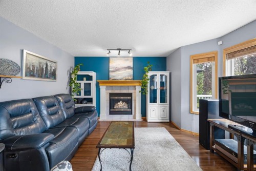 168 Fairways Drive Nw, Airdrie, AB - Indoor Photo Showing Living Room With Fireplace