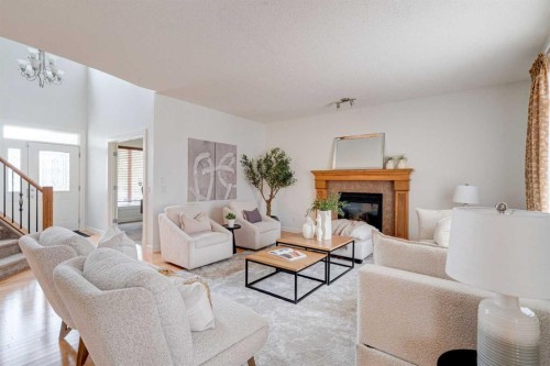 108 Tuscany Estates Close Nw, Calgary, AB - Indoor Photo Showing Living Room With Fireplace