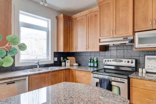 108 Tuscany Estates Close Nw, Calgary, AB - Indoor Photo Showing Kitchen With Double Sink