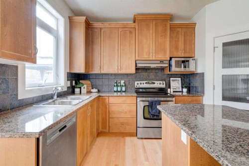 108 Tuscany Estates Close Nw, Calgary, AB - Indoor Photo Showing Kitchen With Double Sink