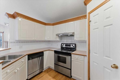 69 Scimitar Point Nw, Calgary, AB - Indoor Photo Showing Kitchen With Double Sink