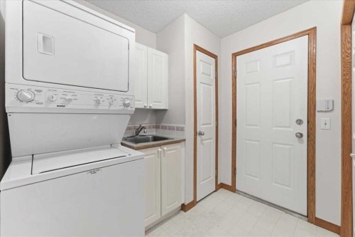 69 Scimitar Point Nw, Calgary, AB - Indoor Photo Showing Laundry Room