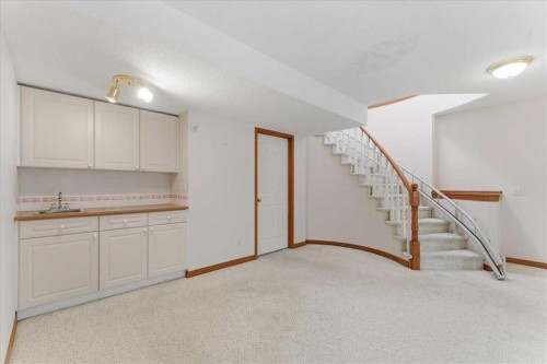 69 Scimitar Point Nw, Calgary, AB - Indoor Photo Showing Other Room