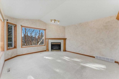 69 Scimitar Point Nw, Calgary, AB - Indoor With Fireplace