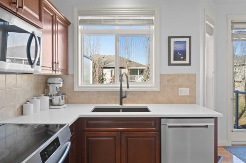 1909 Riverside Drive Nw, High River, AB - Indoor Photo Showing Kitchen With Double Sink