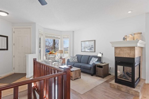 1909 Riverside Drive Nw, High River, AB - Indoor Photo Showing Living Room With Fireplace