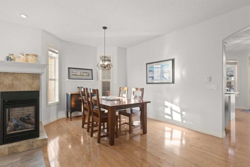 1909 Riverside Drive Nw, High River, AB - Indoor Photo Showing Dining Room With Fireplace