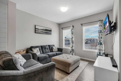 140 Sundown Road, Cochrane, AB - Indoor Photo Showing Living Room