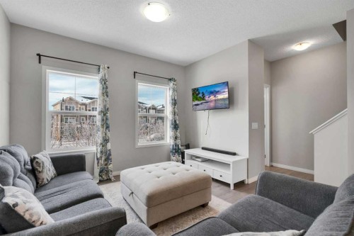 140 Sundown Road, Cochrane, AB - Indoor Photo Showing Living Room