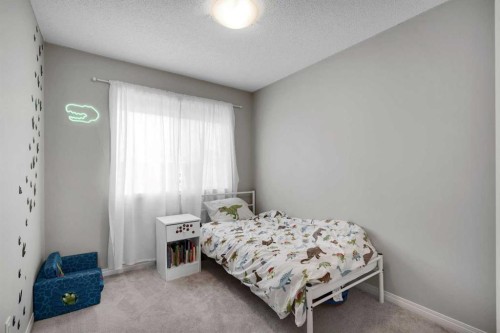 140 Sundown Road, Cochrane, AB - Indoor Photo Showing Bedroom