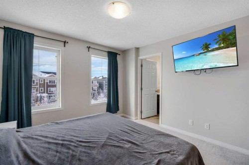 140 Sundown Road, Cochrane, AB - Indoor Photo Showing Bedroom