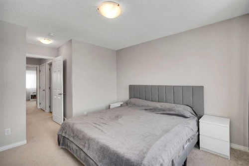 140 Sundown Road, Cochrane, AB - Indoor Photo Showing Bedroom