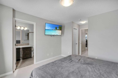 140 Sundown Road, Cochrane, AB - Indoor Photo Showing Bedroom