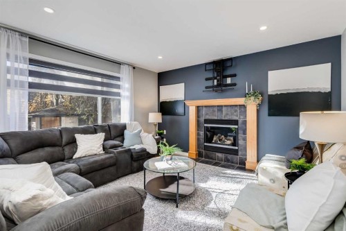 208 Fairways Bay Nw, Airdrie, AB - Indoor Photo Showing Living Room With Fireplace