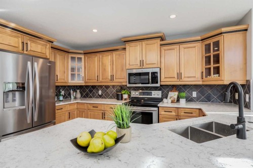 208 Fairways Bay Nw, Airdrie, AB - Indoor Photo Showing Kitchen With Double Sink
