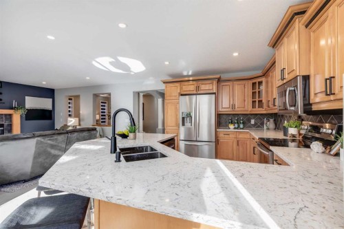 208 Fairways Bay Nw, Airdrie, AB - Indoor Photo Showing Kitchen With Double Sink With Upgraded Kitchen