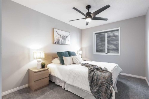 208 Fairways Bay Nw, Airdrie, AB - Indoor Photo Showing Bedroom