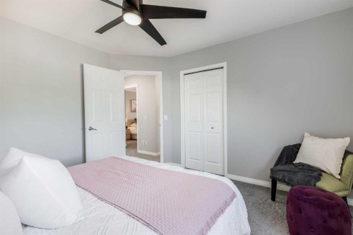 208 Fairways Bay Nw, Airdrie, AB - Indoor Photo Showing Bedroom