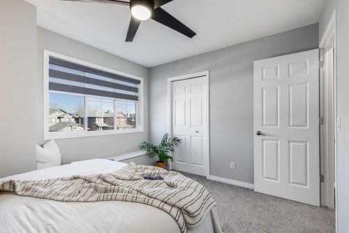 208 Fairways Bay Nw, Airdrie, AB - Indoor Photo Showing Bedroom