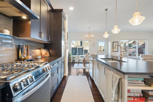 92 Thoroughbred Boulevard, Cochrane, AB - Indoor Photo Showing Kitchen With Double Sink With Upgraded Kitchen