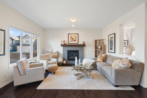 92 Thoroughbred Boulevard, Cochrane, AB - Indoor Photo Showing Living Room With Fireplace
