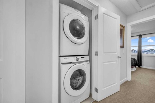 504-1225 Kings Heights Way Se, Airdrie, AB - Indoor Photo Showing Laundry Room