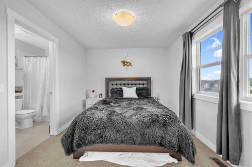 504-1225 Kings Heights Way Se, Airdrie, AB - Indoor Photo Showing Bedroom