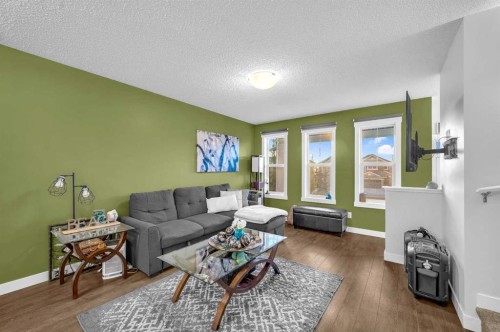 504-1225 Kings Heights Way Se, Airdrie, AB - Indoor Photo Showing Living Room