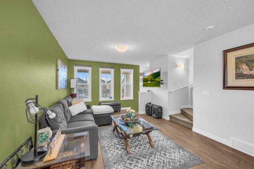 504-1225 Kings Heights Way Se, Airdrie, AB - Indoor Photo Showing Living Room