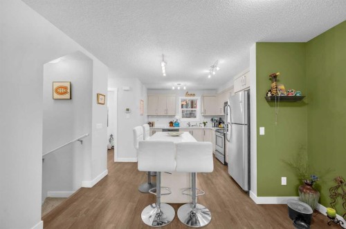 504-1225 Kings Heights Way Se, Airdrie, AB - Indoor Photo Showing Kitchen