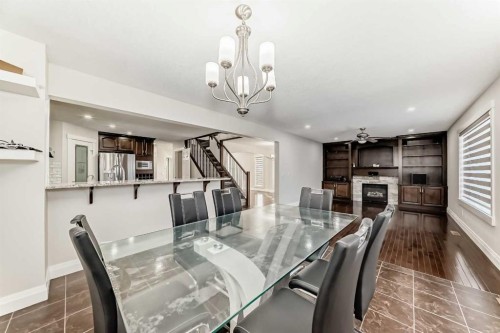 40 Martha'S Meadow Place Ne, Calgary, AB - Indoor Photo Showing Dining Room With Fireplace