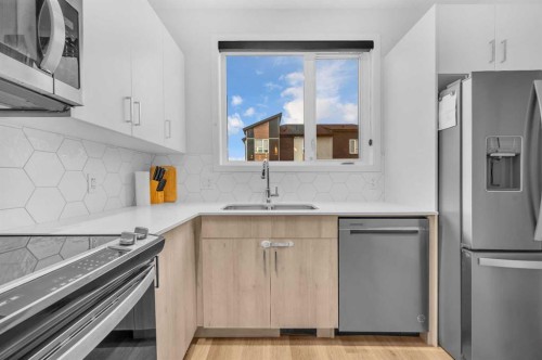 348-301 Redstone Boulevard Ne, Calgary, AB - Indoor Photo Showing Kitchen With Stainless Steel Kitchen With Double Sink