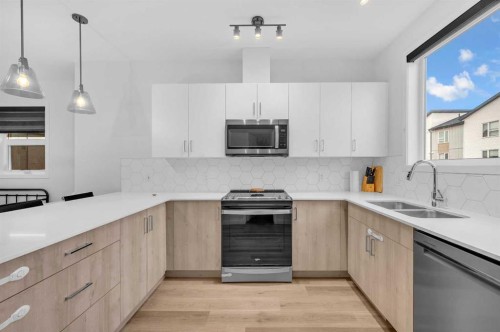 348-301 Redstone Boulevard Ne, Calgary, AB - Indoor Photo Showing Kitchen With Double Sink With Upgraded Kitchen