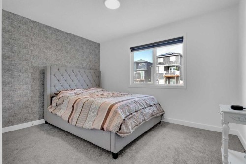 264 Lucas Way Nw, Calgary, AB - Indoor Photo Showing Bedroom