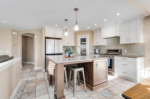 1719 Woodside Boulevard Nw, Airdrie, AB - Indoor Photo Showing Kitchen With Upgraded Kitchen