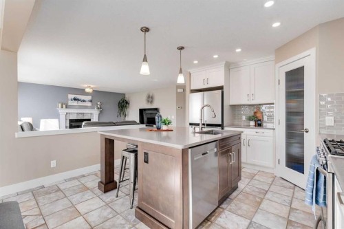 1719 Woodside Boulevard Nw, Airdrie, AB - Indoor Photo Showing Kitchen With Upgraded Kitchen