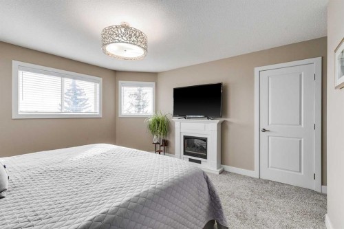 1719 Woodside Boulevard Nw, Airdrie, AB - Indoor Photo Showing Bedroom