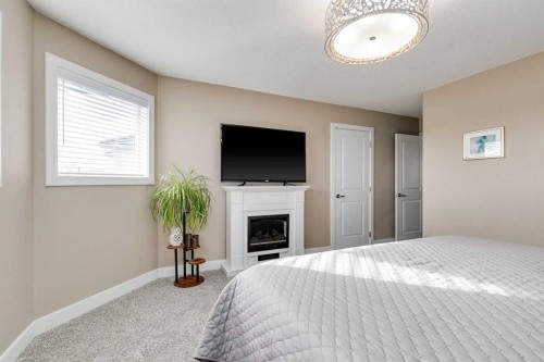 1719 Woodside Boulevard Nw, Airdrie, AB - Indoor Photo Showing Bedroom