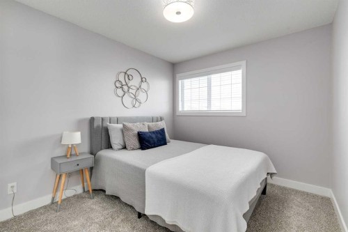 1719 Woodside Boulevard Nw, Airdrie, AB - Indoor Photo Showing Bedroom