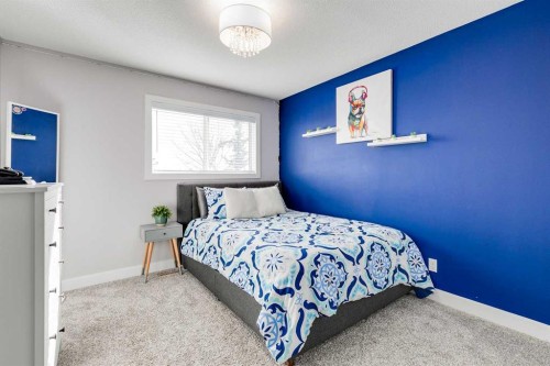 1719 Woodside Boulevard Nw, Airdrie, AB - Indoor Photo Showing Bedroom
