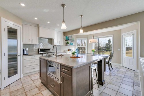 1719 Woodside Boulevard Nw, Airdrie, AB - Indoor Photo Showing Kitchen With Upgraded Kitchen