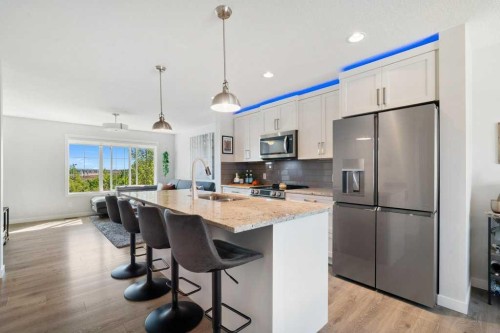 2202-250 Fireside View, Cochrane, AB - Indoor Photo Showing Kitchen With Stainless Steel Kitchen With Upgraded Kitchen